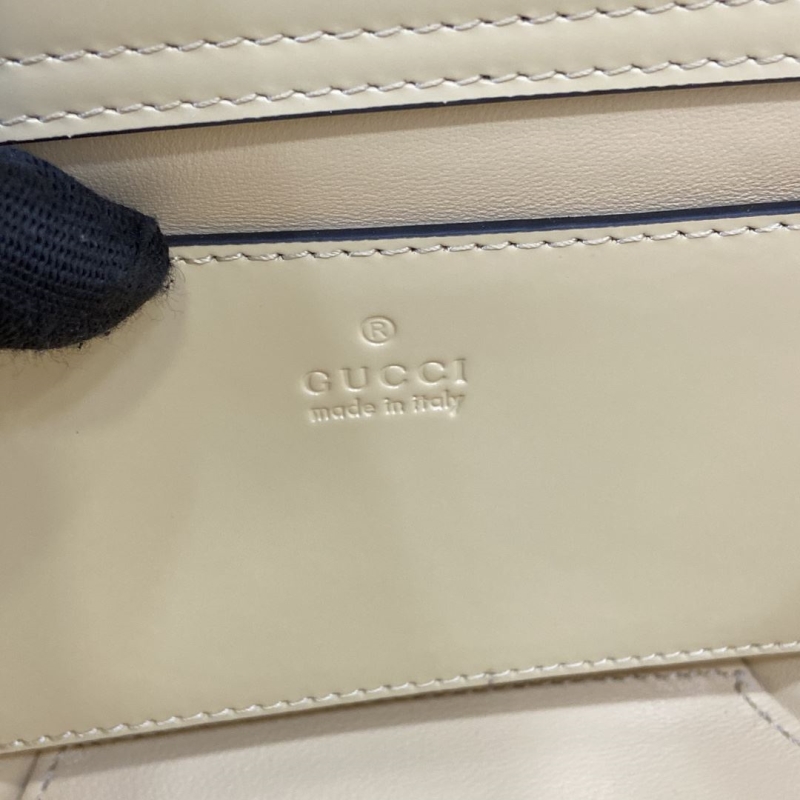G*u*i shopping bags